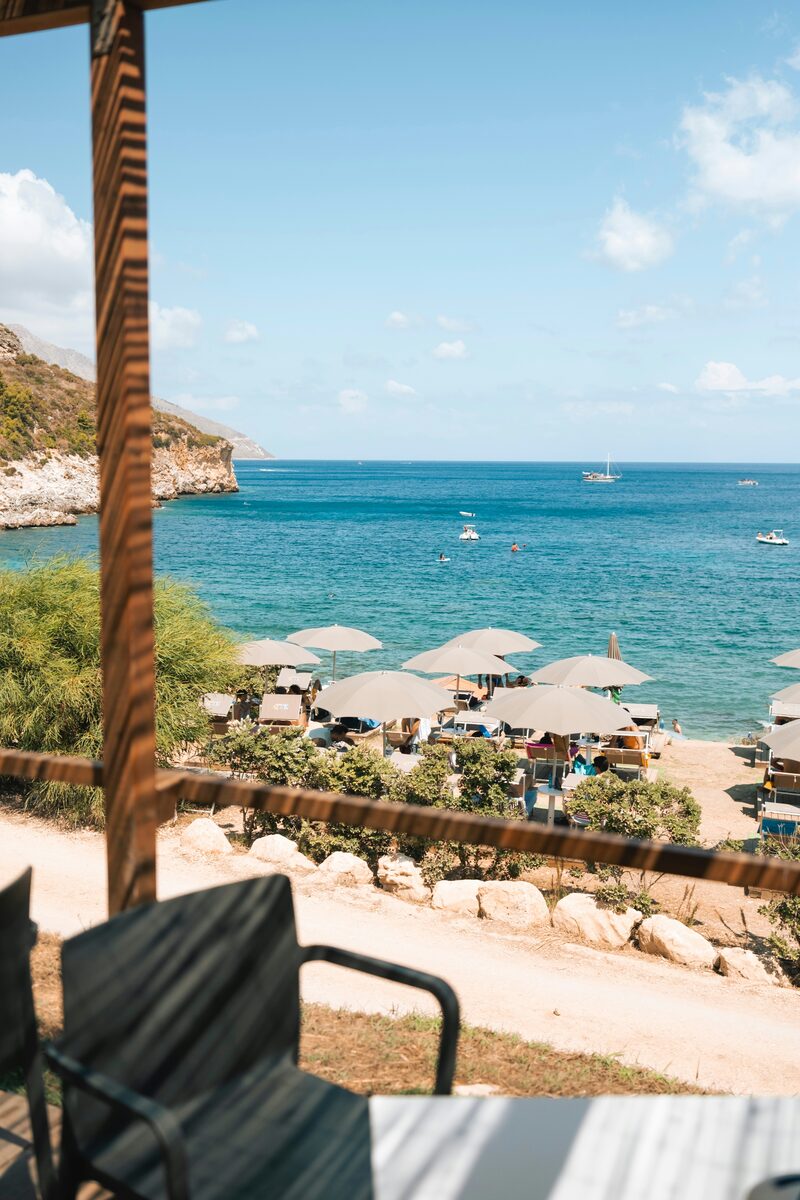 Resort beach with lounge umbrellas overlooking the ocean